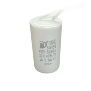 White 8µF gate motor capacitor with attached wire leads for compatible automation repairs