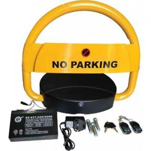 Yellow automatic parking lock barrier with battery, remotes, charger, and fixings.