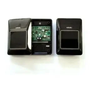 FAAC XP 30 wall-mounted photocell pair shown with one cover removed, revealing the circuit board for automatic gate safety.